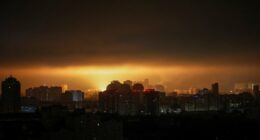 Drone explosion lights up Kyiv night sky.