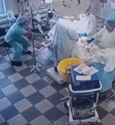 Surgeons performing surgery during an earthquake.