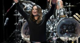 Ozzy Osbourne performing on stage.