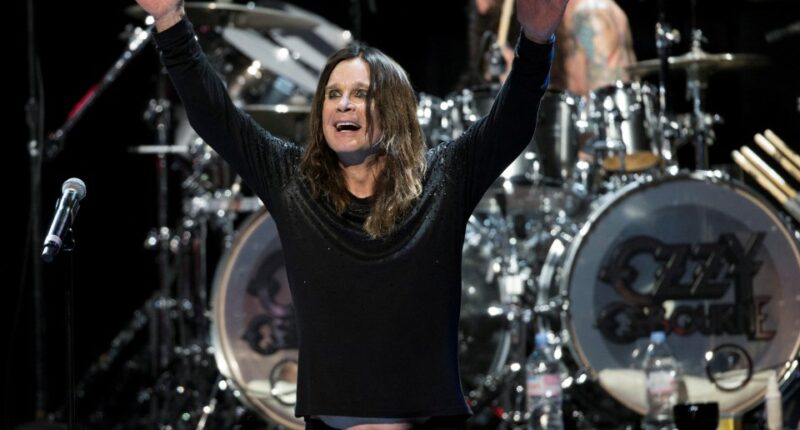 Ozzy Osbourne performing on stage.