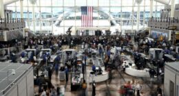 Passengers flee smoking jet on emergency slide after apparent landing gear problem at Denver airport