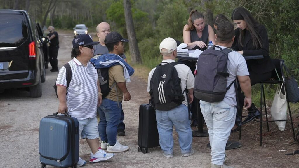 Pictured: Dwarves and scantily-clad women arrive at Yamal's party