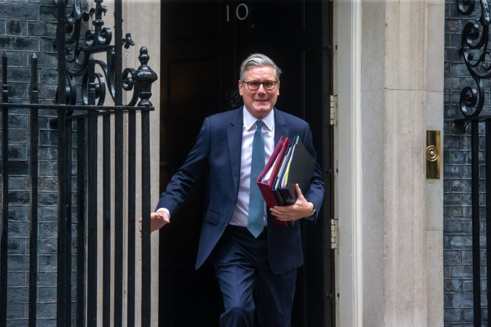 Keir Starmer leaving 10 Downing Street carrying files.