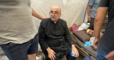Wounded Palestinians, including Father Jebrail Romanelli, at Al-Ahli Baptist Hospital.