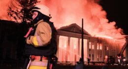 Firefighters battling a fire at a building in Kharkiv, Ukraine.