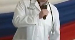 Ilya Sorokin, a Russian prison doctor accused of torturing Ukrainian prisoners of war, speaking into a microphone.