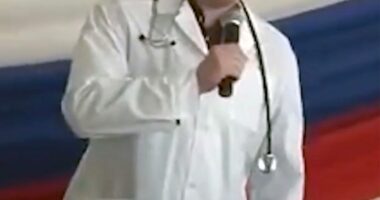 Ilya Sorokin, a Russian prison doctor accused of torturing Ukrainian prisoners of war, speaking into a microphone.