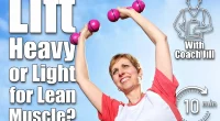 Mature woman exercising outdoors in the fresh air, raising dumbbells above her head. Should You Lift Heavier With Fewer Reps or Lighter With More To Build Lean Muscle?