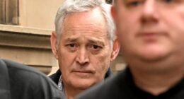 Close-up of Ian Wilkinson outside a court building.