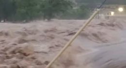 Texan city begins to disappear underwater as flooded river bursts