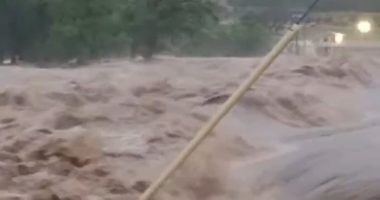 Texan city begins to disappear underwater as flooded river bursts