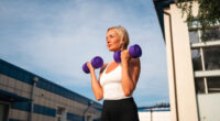 middle-age woman doing bicep curls, concept of exercises for women to stay fit after 40