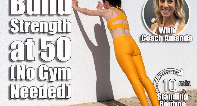 Sporty woman doing push off exercises against a wall. This 10-Minute Standing Routine Builds More Strength Than Gym Workouts After 50. Cover
