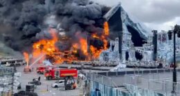 Firefighters battling a fire at the Tomorrowland festival main stage.