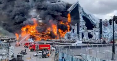 Firefighters battling a fire at the Tomorrowland festival main stage.