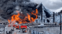Large fire engulfing a stage set.