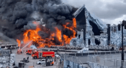 Large fire engulfing a stage set.