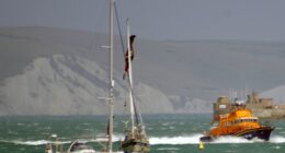 Lifeboat responding to a kite surfer incident near a yacht.