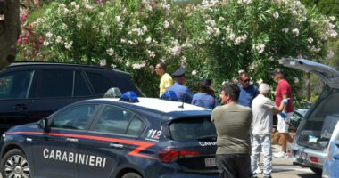Carabinieri at a car accident scene.