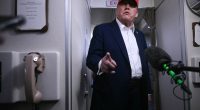 Donald Trump speaking to reporters aboard Air Force One.