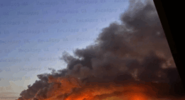 Large fire burning at night.