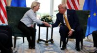 Donald Trump and Ursula von der Leyen shaking hands.