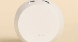 White Pura smart home fragrance diffuser.