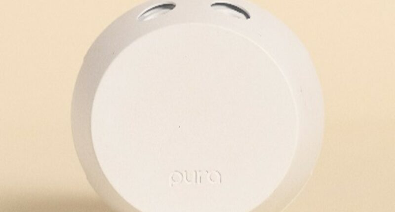 White Pura smart home fragrance diffuser.