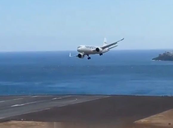 Plane landing in strong winds at Madeira Airport.