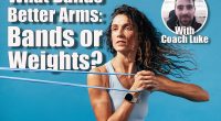 Close up of caucasian woman exercising with a resistance band. Young fitness female training on blue background.