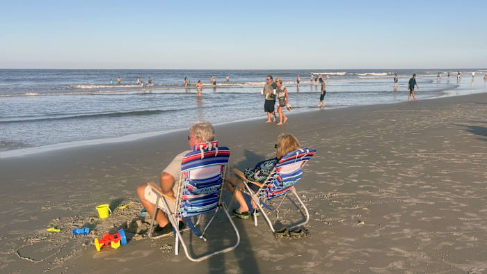 ‘You just got to be careful’: Swimmers take to New Smyrna Beach after shark bite