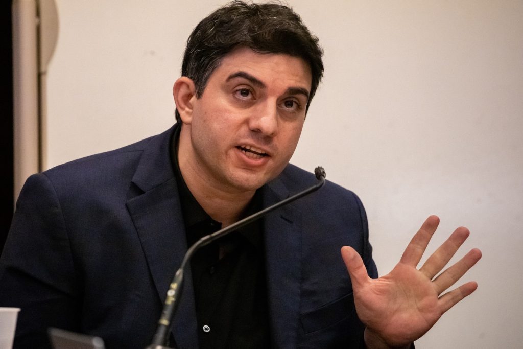 Hossein Nayeri speaks into a mic.