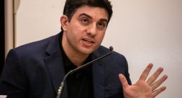Hossein Nayeri speaks into a mic.