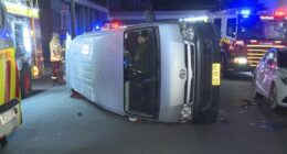 The allegedly drunk driver was seen standing up straight in his van that was on its side.