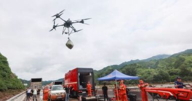 BEIJING, CHINA - JULY 28: Rescuers use a drone to transport relief supplies after intense downpour triggers road disruptions at Liulimiao Town in Huairou District on July 28, 2025 in Beijing, China. Since July 26, consecutive rainfall has affected Beijing's northern suburban districts of Miyun, Huairou and Yanqing. The intense downpour triggered flooding and landslides, impacting several villages and disrupting roads, power supplies and communications in some areas. (Photo by Jia Tianyong/China