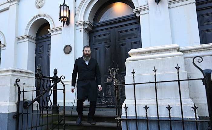 Congregation flees after arsonist sets fire to an Australian synagogue door