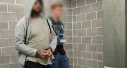 A﻿ member of a notorious dog breeding group has been charged with assault over an alleged altercation at a Sydney terrier show.