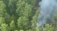 The site of a plane crash in Russia.