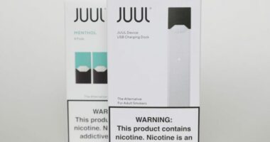 Packaging for an electronic cigarette and menthol pods from Juul Labs is displayed on Feb. 25, 2020, in Pembroke Pines, Fla. (AP Photo/Brynn Anderson, File)