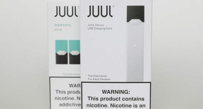 Packaging for an electronic cigarette and menthol pods from Juul Labs is displayed on Feb. 25, 2020, in Pembroke Pines, Fla. (AP Photo/Brynn Anderson, File)