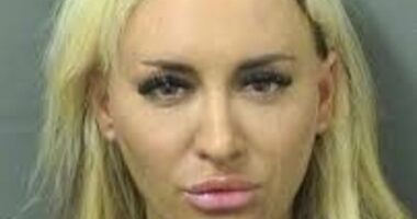 Former Fox News host's accuser Jennifer Eckhart pouts in mugshot after being arrested for battery