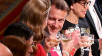 French President Emmanuel Macron winks at Catherine, Princess of Wales during banquet