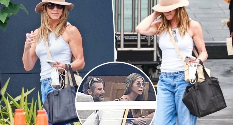 Glowing Jennifer Aniston touches down after cozy Mallorca vacation with rumored beau Jim Curtis