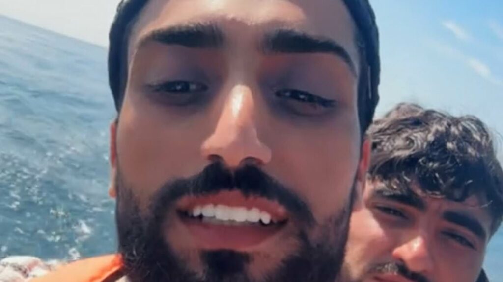 Grinning small boat migrant chronicles his journey across the Channel to the UK - as he films himself celebrating on Blackpool beach after illegally crossing into Britain