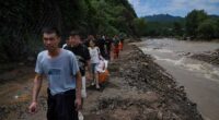 Heavy rain causes flooding, evacuations and at least 38 deaths around Beijing region