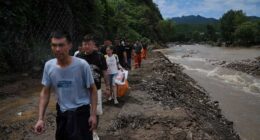 Heavy rain causes flooding, evacuations and at least 38 deaths around Beijing region
