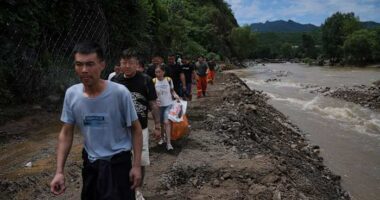 Heavy rain causes flooding, evacuations and at least 38 deaths around Beijing region