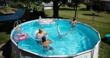 People enjoy the summer day in the pool on Wednesday, June 24, 2020, in Omaha, Neb. (Anna Reed/Omaha World-Herald via AP, File)