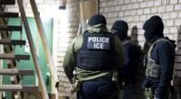 U.S. Immigration and Customs Enforcement officers wait to detain a person, Jan. 27, 2025, in Silver Spring, Md. (AP Photo/Alex Brandon, File)