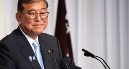 Japan's Ishiba says he'll stay in office to tackle inflation and US tariffs despite election loss